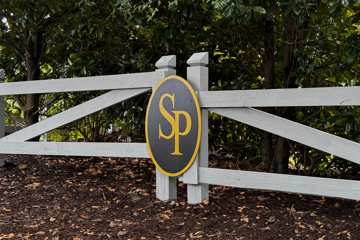 Close-up of a richly stained oil-based wood fence