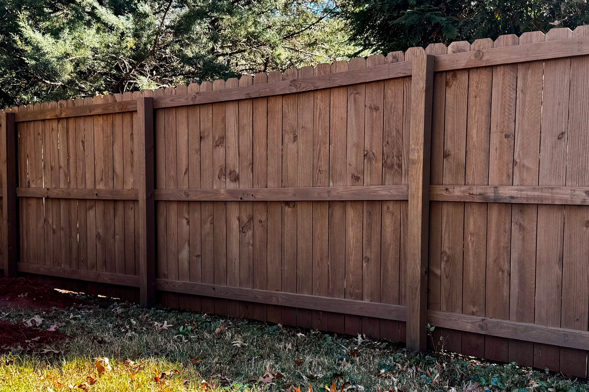 Warm brown oil-stained privacy fence